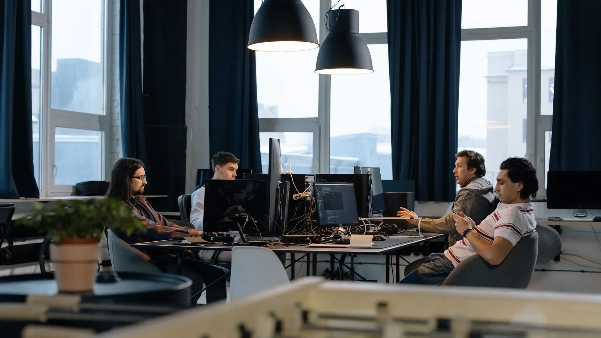 Software development team working across a modern open-plan office