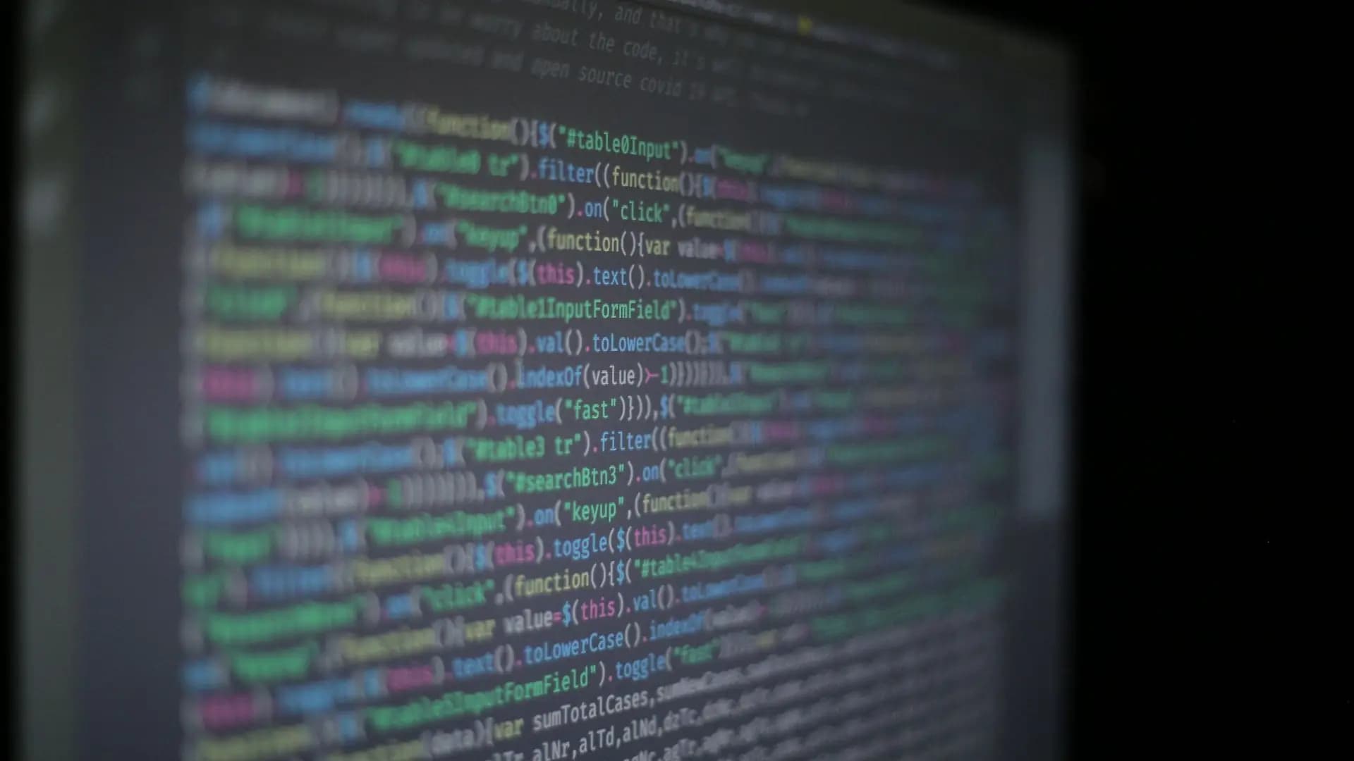 Application source code on a developer monitor, representing custom Odoo Community module development
